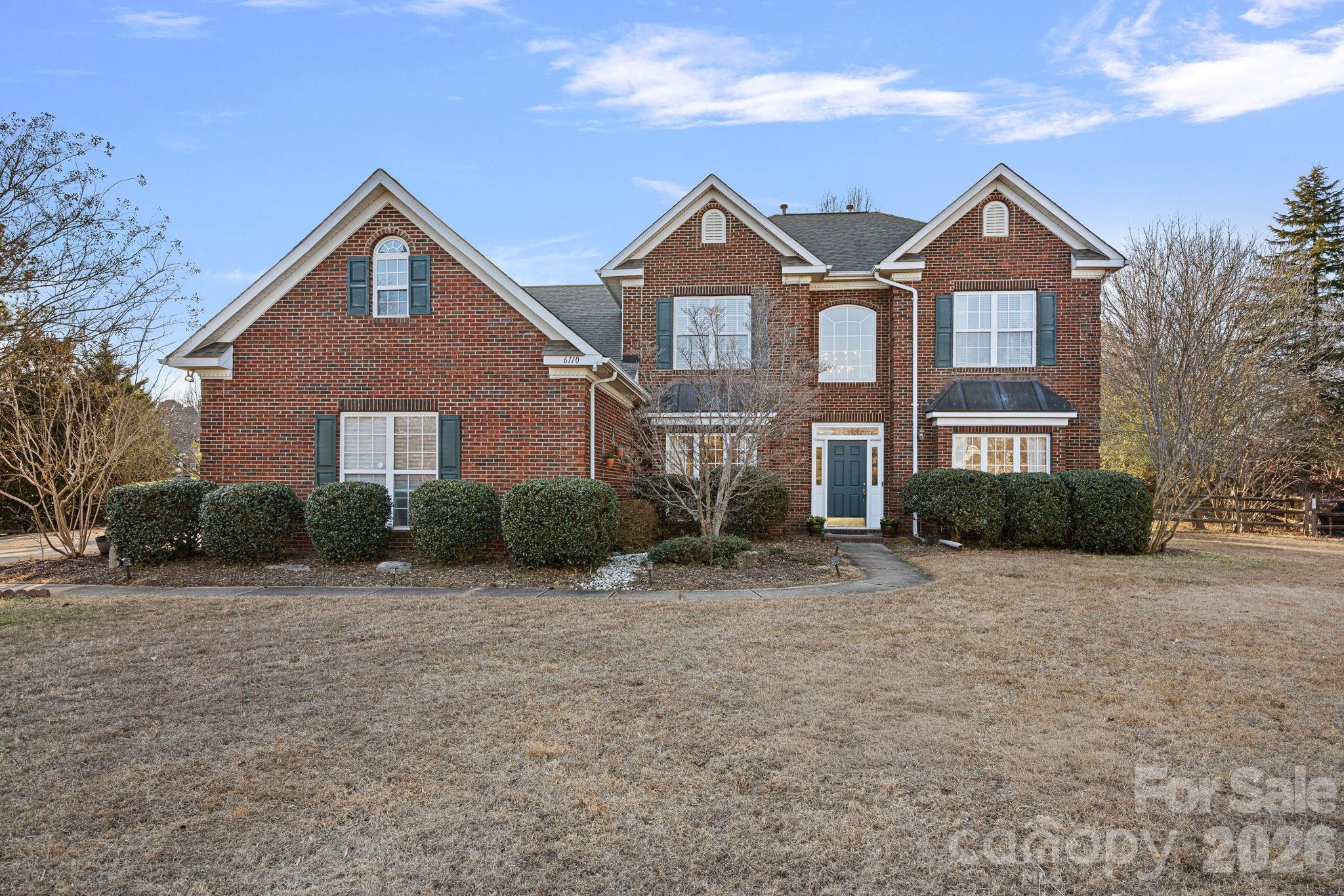 6110 Flowergate Lane Waxhaw, NC 28173 - Photo 1 of 39 a front view of a house with a yard
