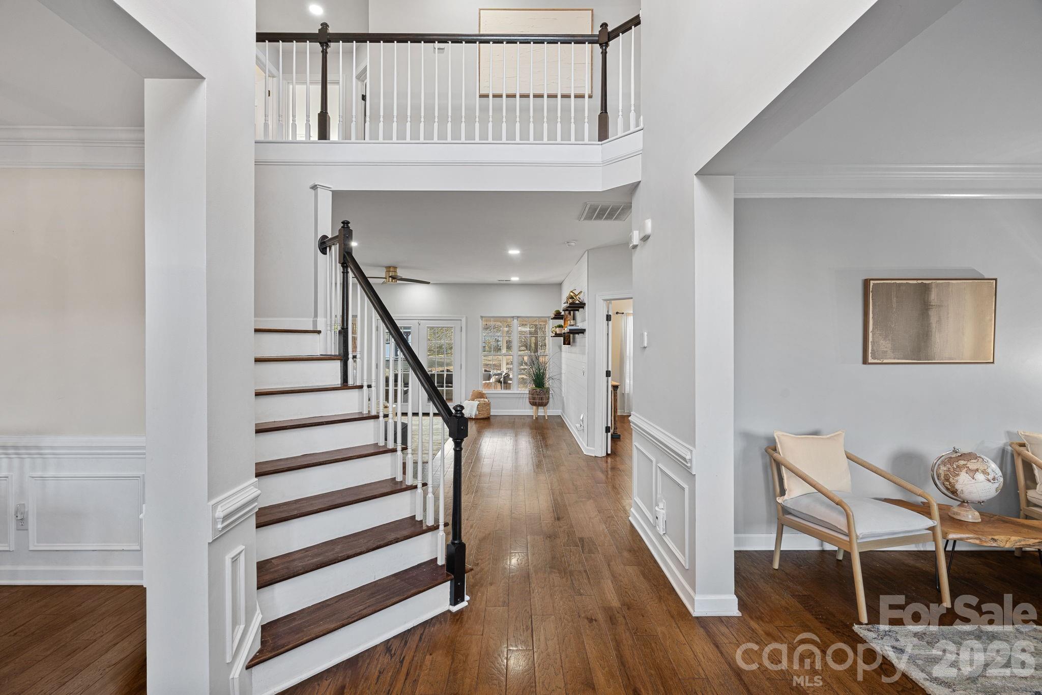 6110 Flowergate Lane Waxhaw, NC 28173 - Photo 11 of 39 a view of entryway and hall with wooden floor