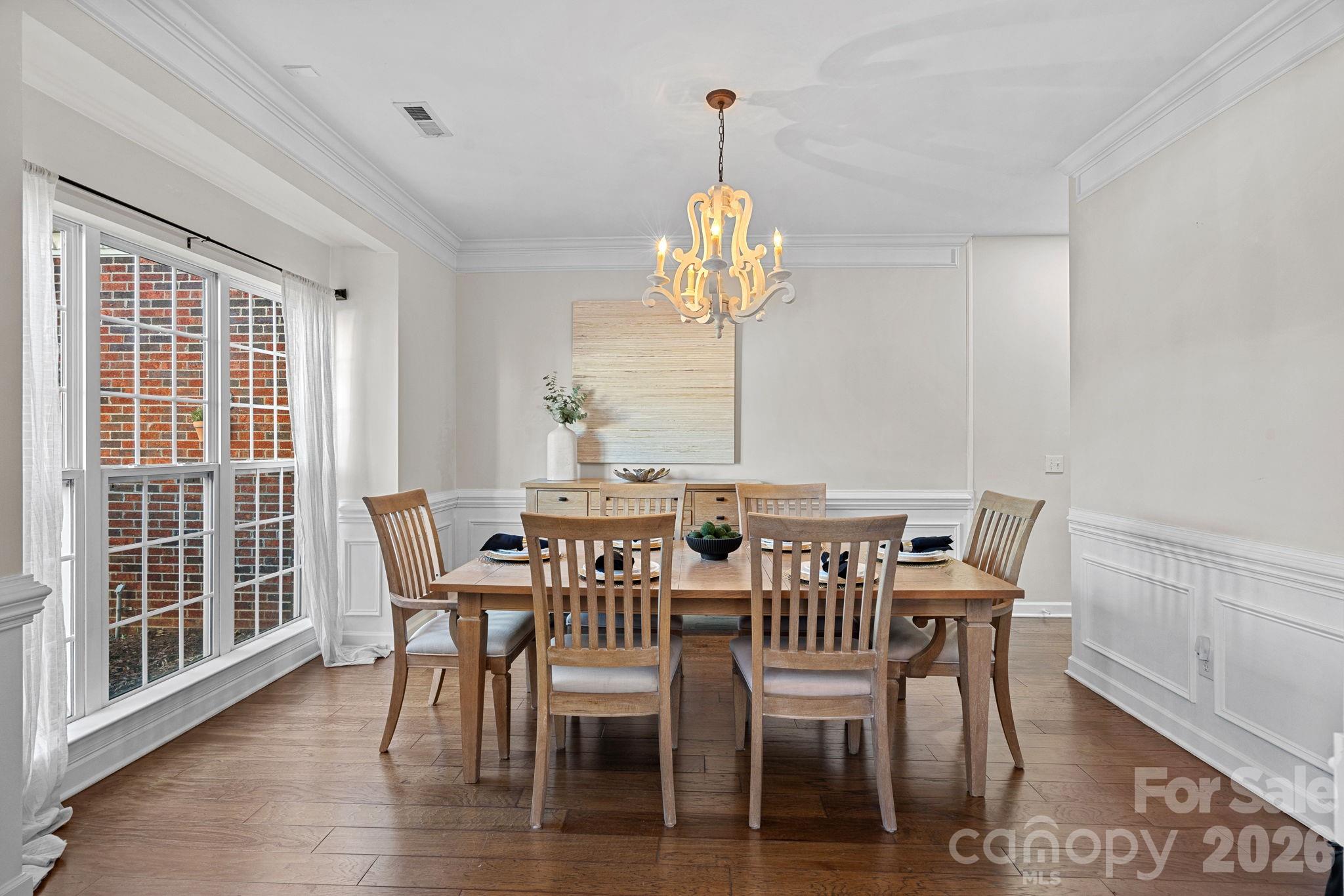6110 Flowergate Lane Waxhaw, NC 28173 - Photo 13 of 39 a view of a dining room with furniture wooden floor and chandelier