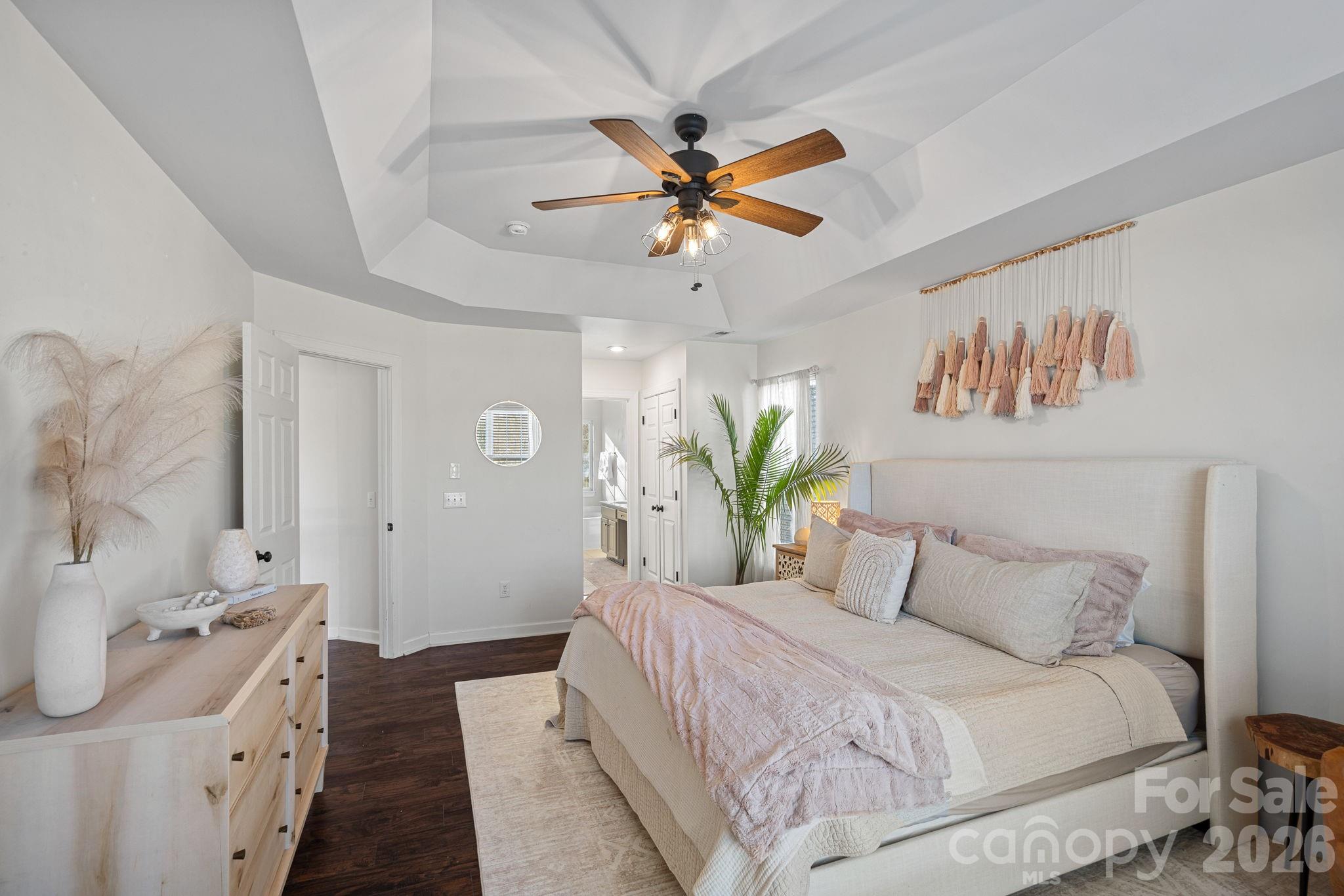 6110 Flowergate Lane Waxhaw, NC 28173 - Photo 21 of 39 a bedroom with a bed and a chandelier