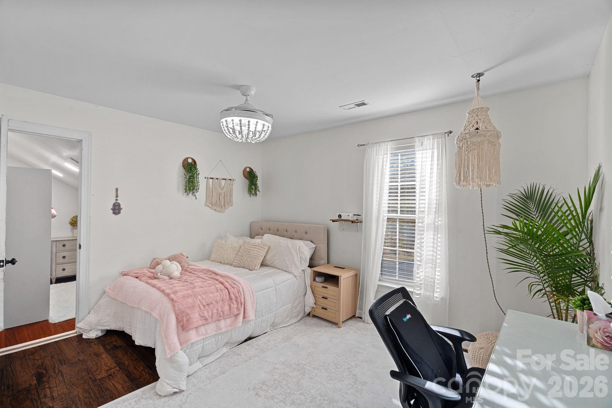 6110 Flowergate Lane Waxhaw, NC 28173 - Photo 25 of 39 a bedroom with a bed and a window