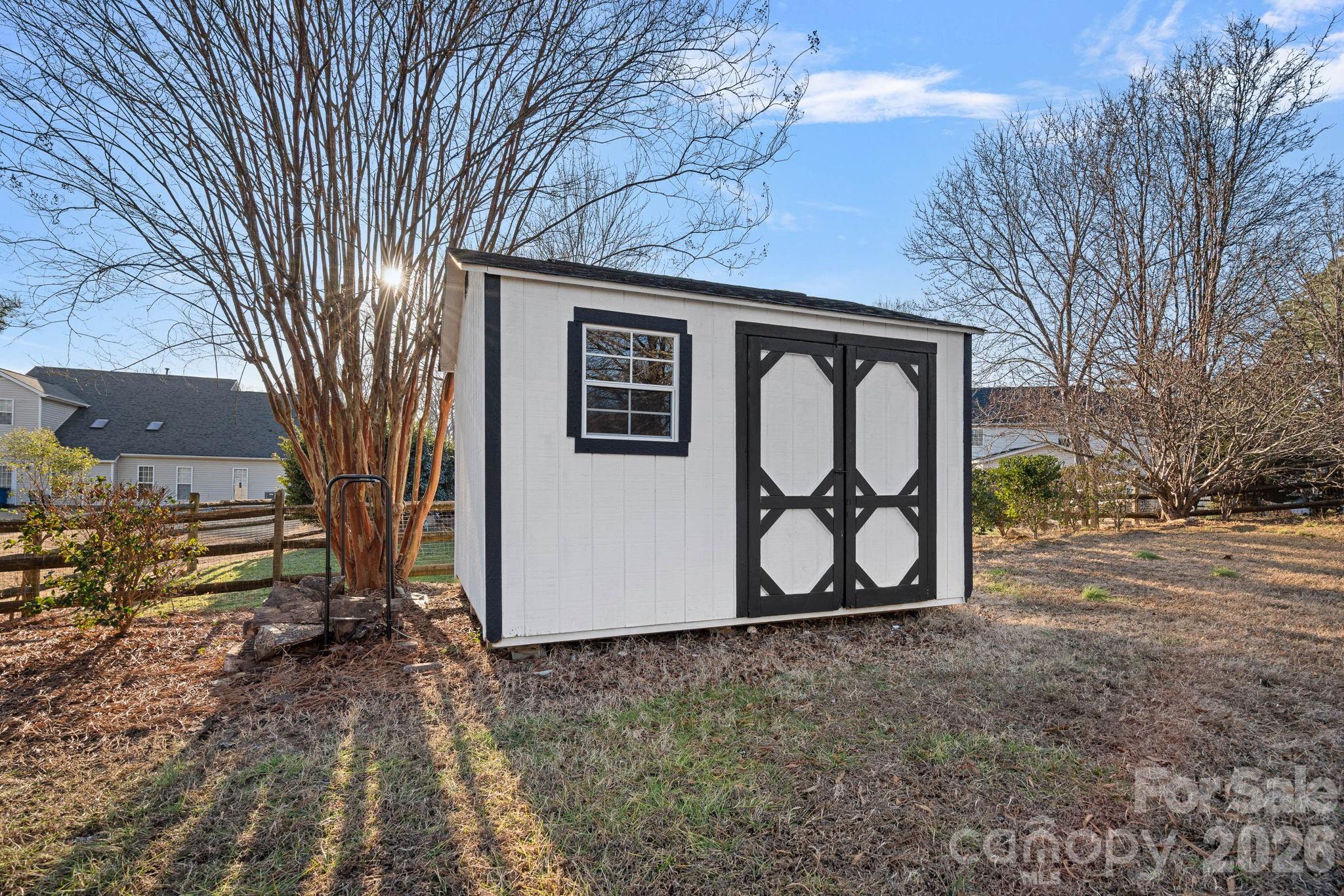 6110 Flowergate Lane Waxhaw, NC 28173 - Photo 32 of 39 a sign that is on the side of the road