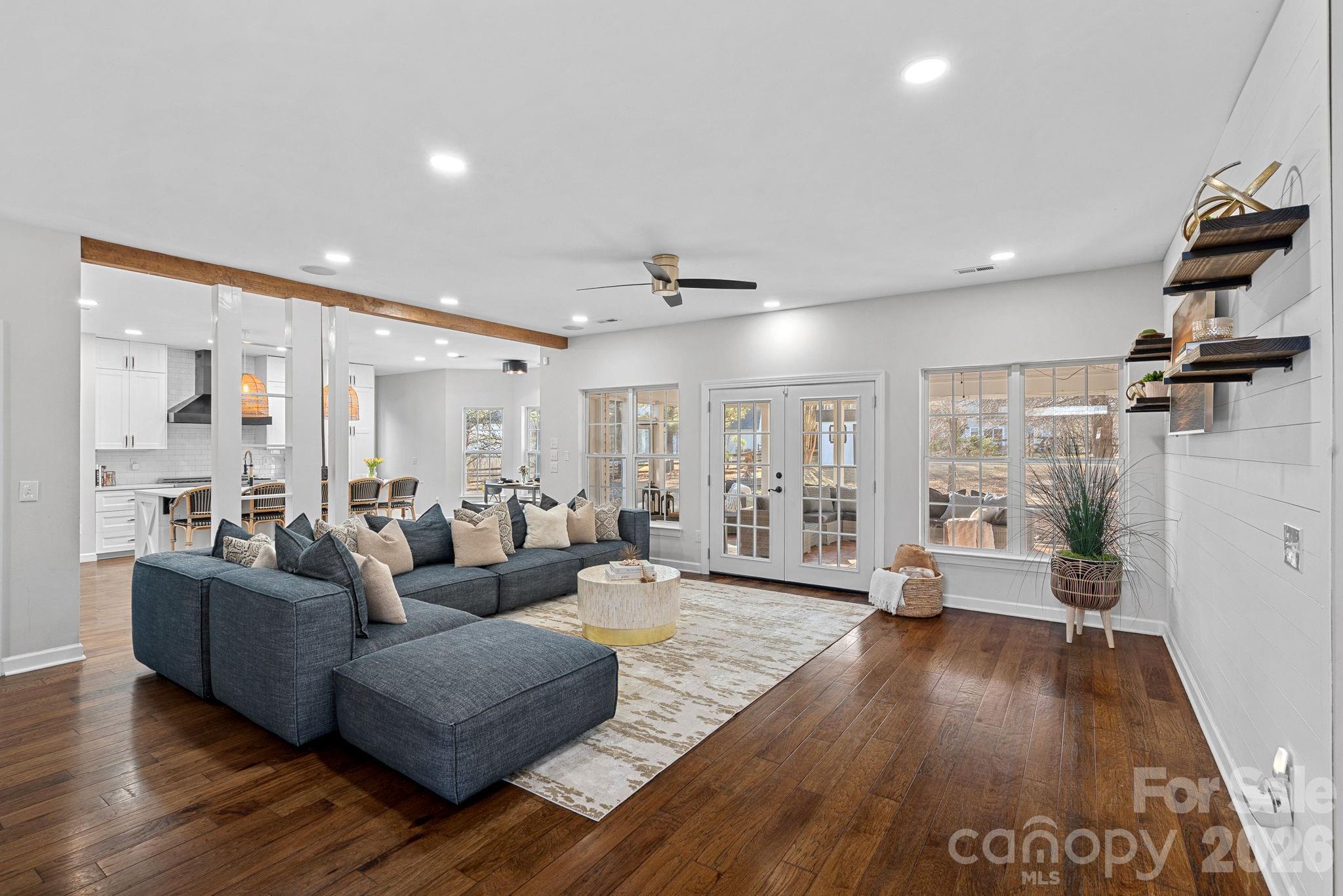 6110 Flowergate Lane Waxhaw, NC 28173 - Photo 8 of 39 a living room with furniture and a wooden floor