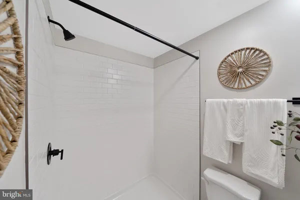 a bathroom with a table and a shower