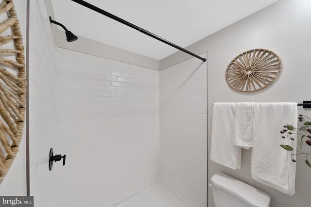a bathroom with a table and a shower