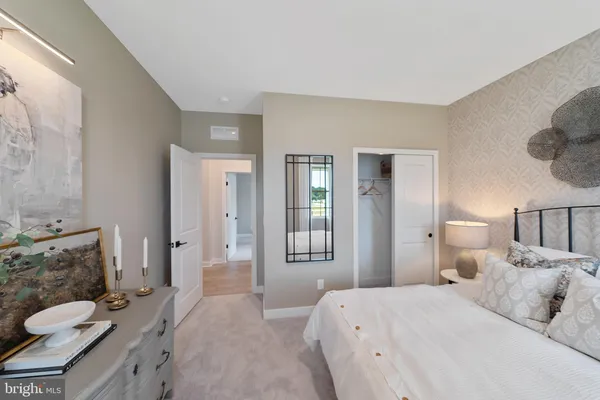 a bedroom with a bed and furniture