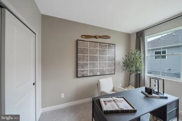 a view of a workspace with furniture