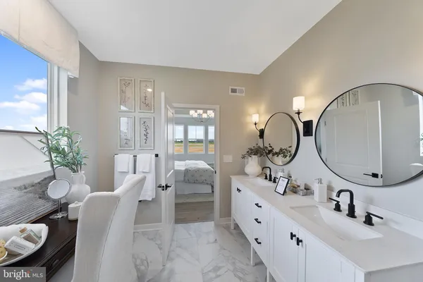 a bathroom with a double vanity sink and a mirror