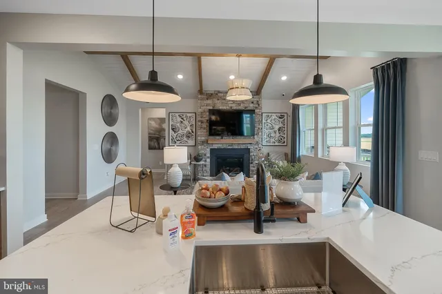 a dining room with furniture a window and a chandelier