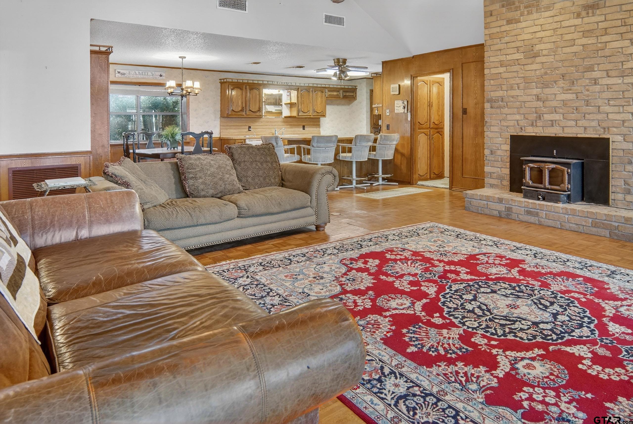 520 County Road 3445 Emory, TX 75440 - Photo 16 of 31 a living room with a couch and a fireplace
