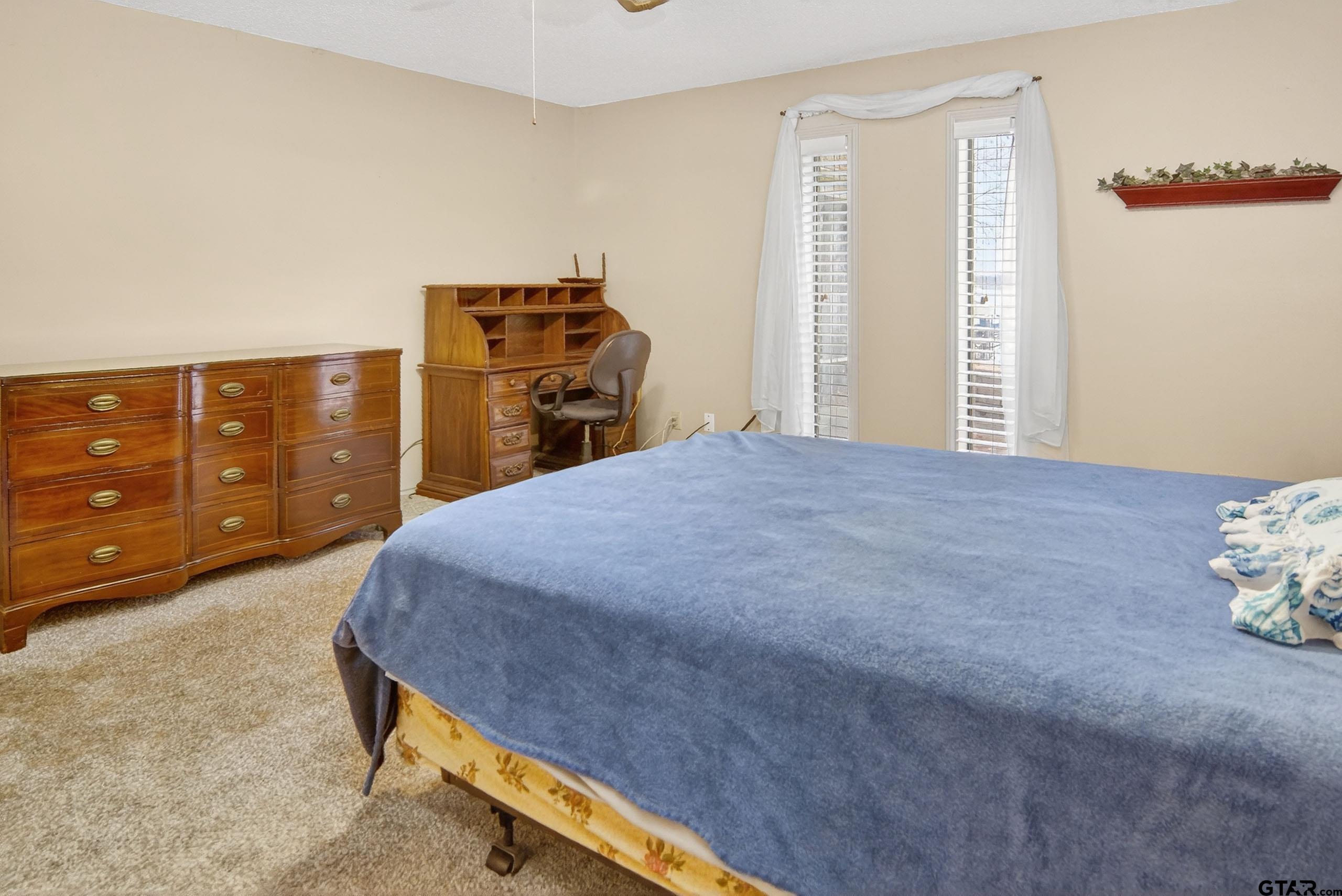 520 County Road 3445 Emory, TX 75440 - Photo 20 of 31 a bed sitting in a bedroom and chair