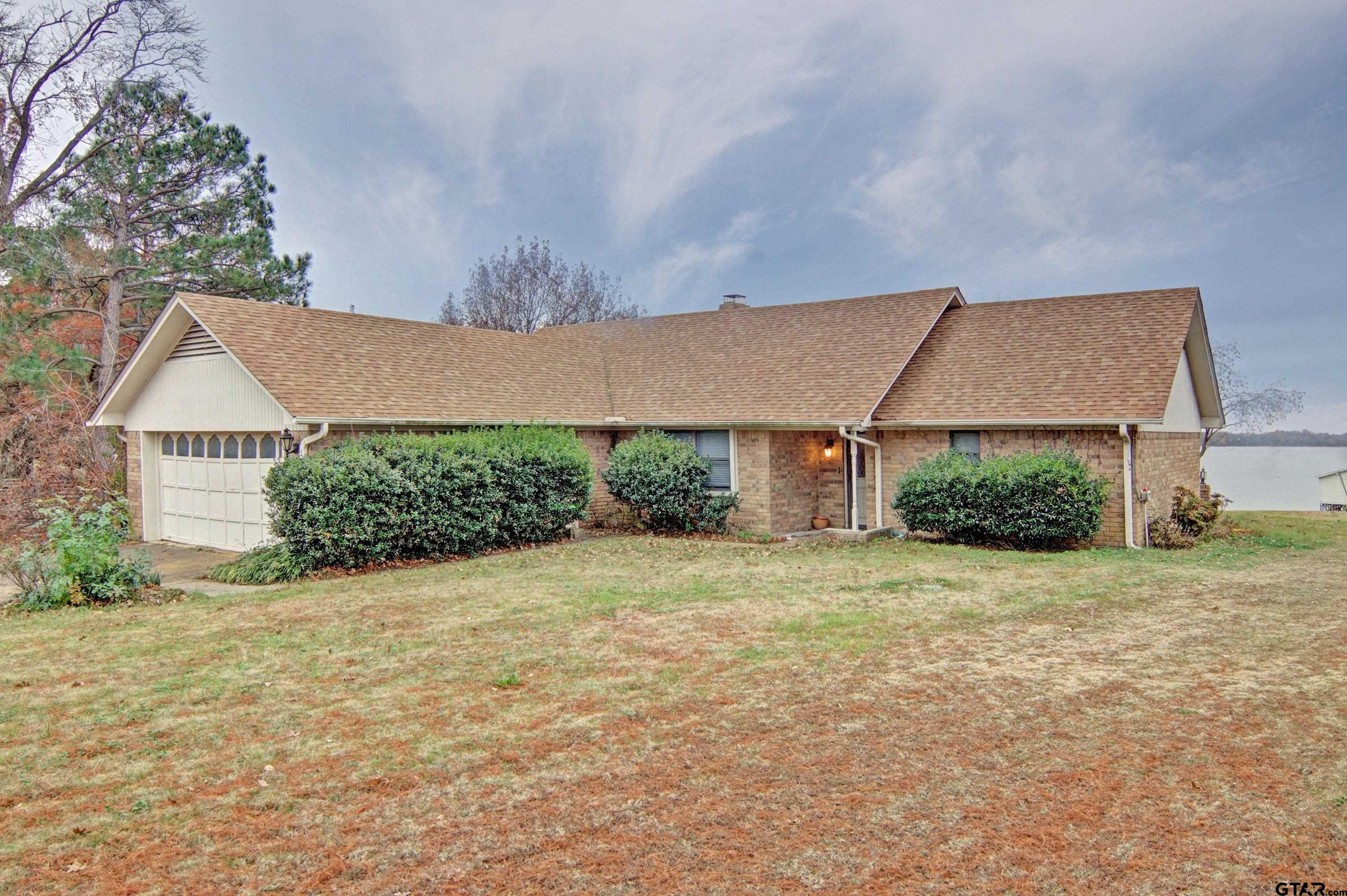 520 County Road 3445 Emory, TX 75440 - Photo 2 of 31 a view of a house with a yard and garage