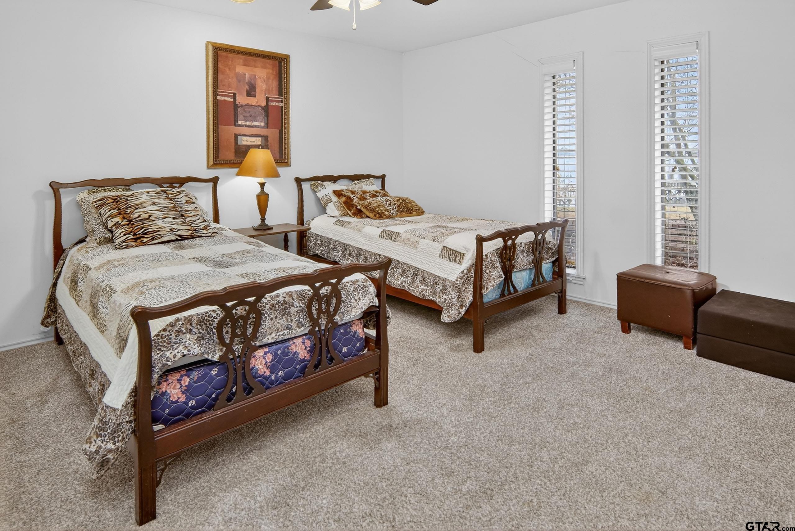 520 County Road 3445 Emory, TX 75440 - Photo 23 of 31 a bedroom with two beds and a couch