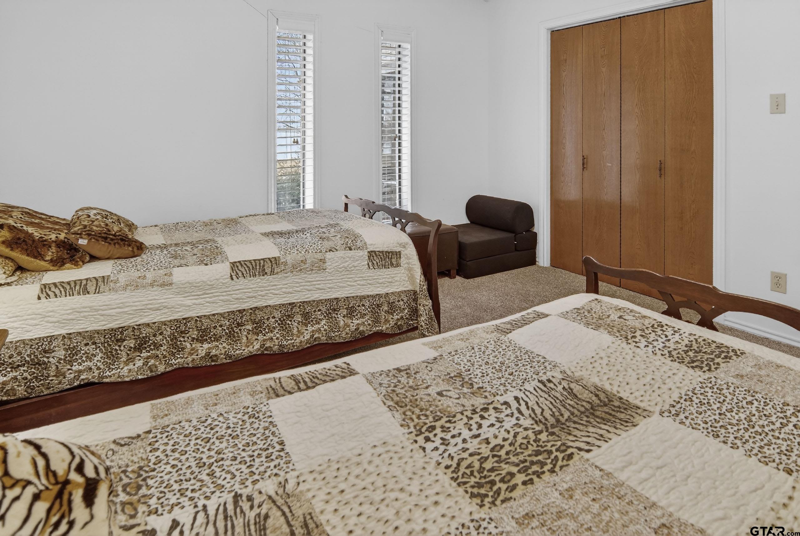 520 County Road 3445 Emory, TX 75440 - Photo 24 of 31 a bedroom with a bed and a dresser