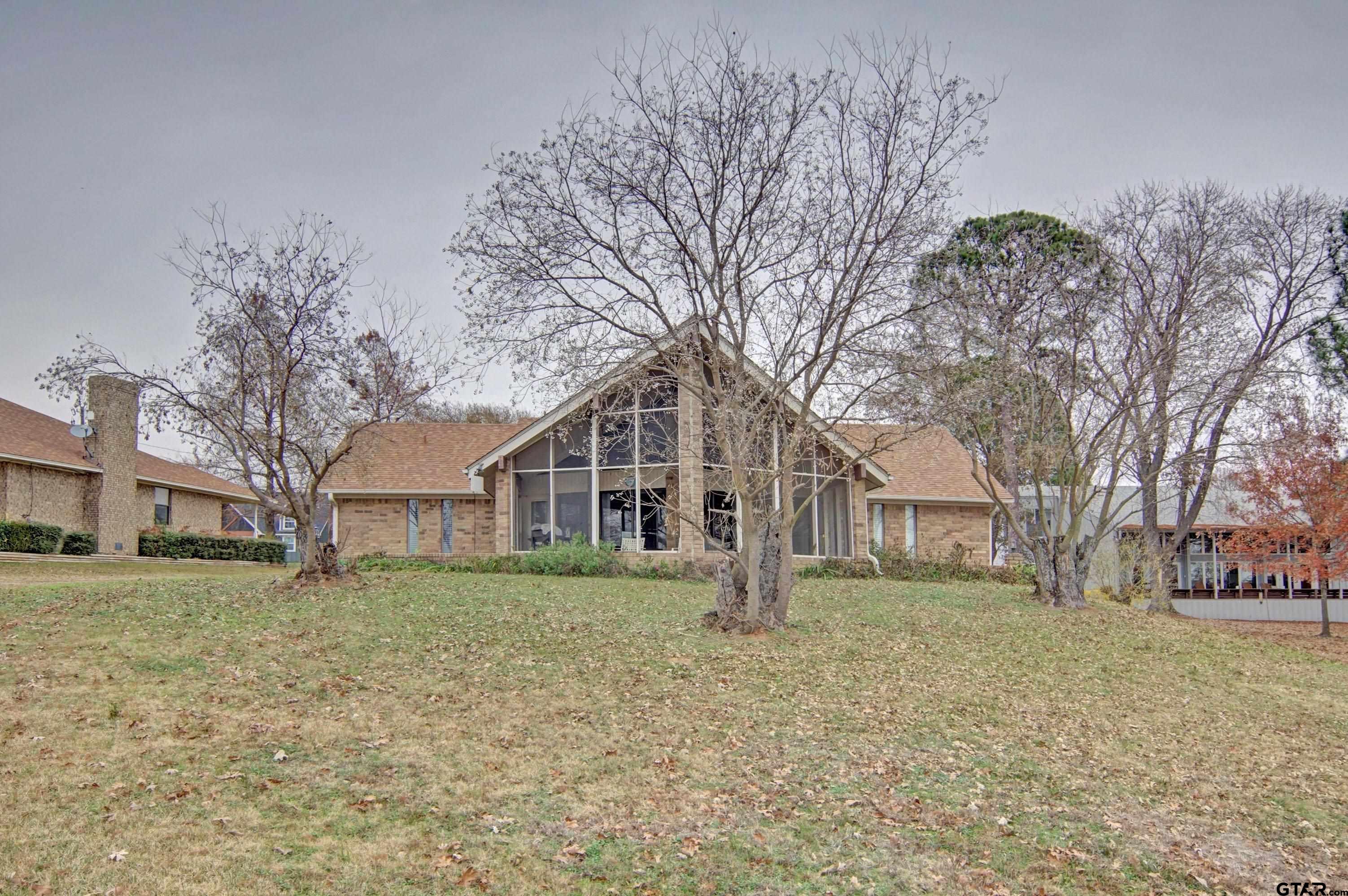 520 County Road 3445 Emory, TX 75440 - Photo 4 of 31 a white house that has a tree in front of it