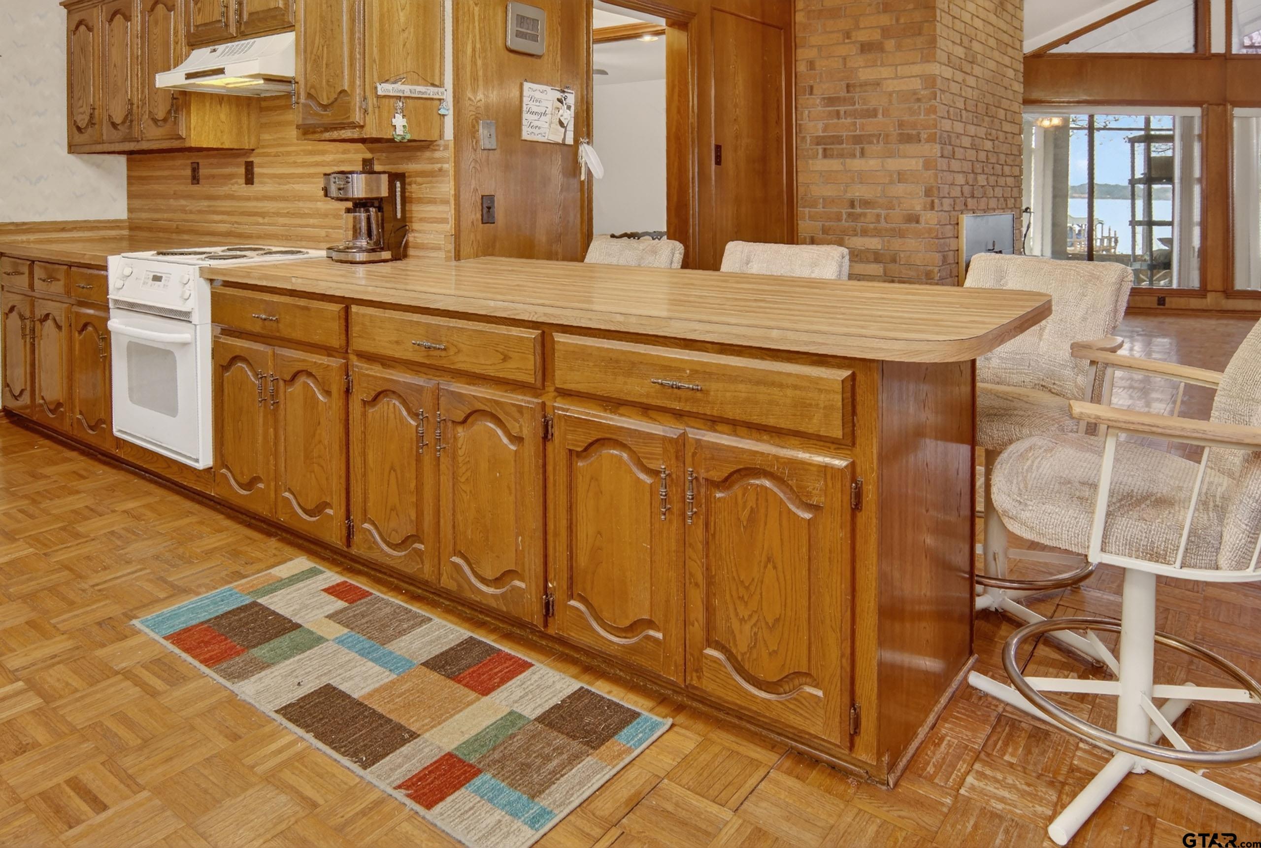 520 County Road 3445 Emory, TX 75440 - Photo 9 of 31 a kitchen with stainless steel appliances a sink and cabinets