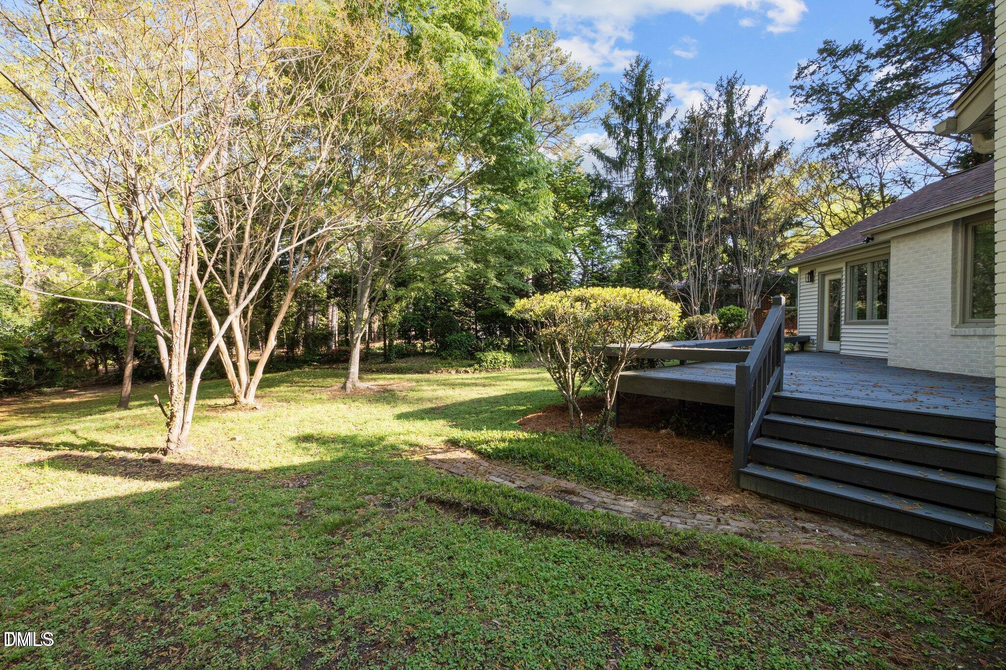 3014 Hope Valley Road Durham, NC 27707 - Photo 12 of 15 a view of backyard with swimming pool and sitting area