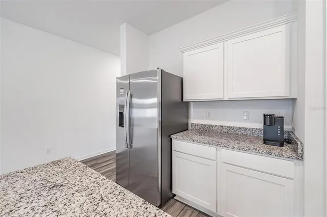 a kitchen with a sink and large window