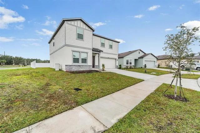 an aerial view of a house with a ocean view