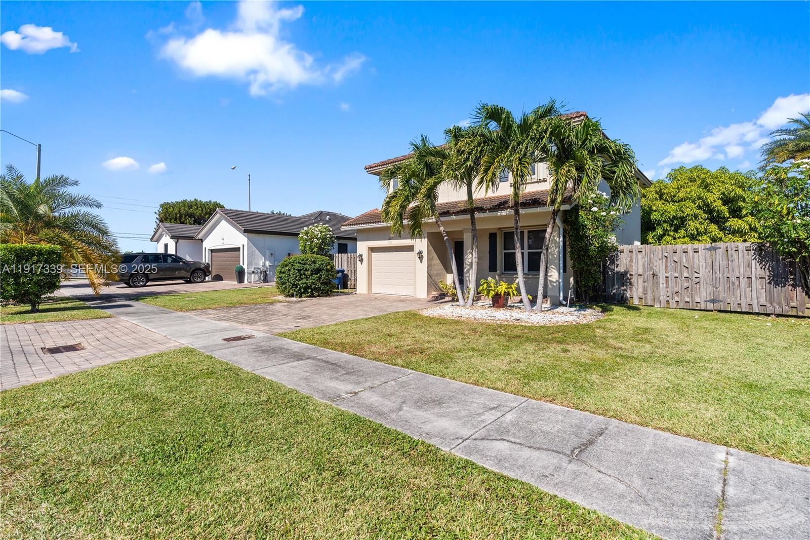 11121 Southwest 225th Terrace Miami, FL 33170 - Photo 1 of 41 a view of a house with swimming pool and a yard