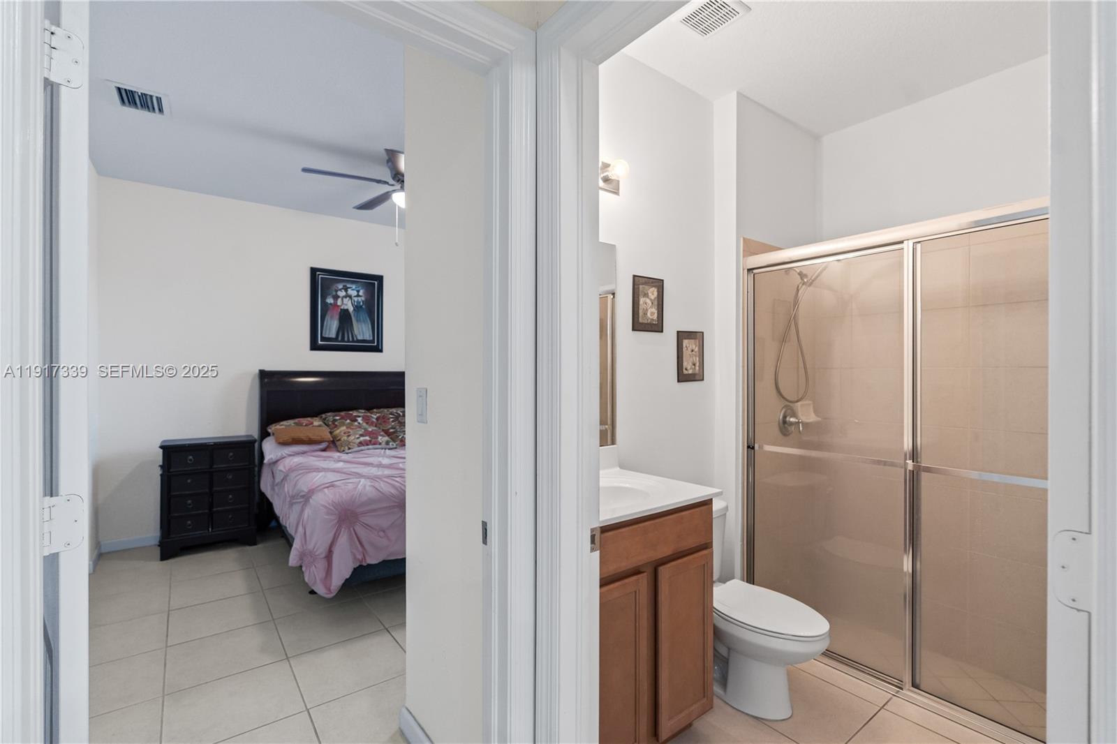 11121 Southwest 225th Terrace Miami, FL 33170 - Photo 11 of 41 a bathroom with a sink toilet and shower