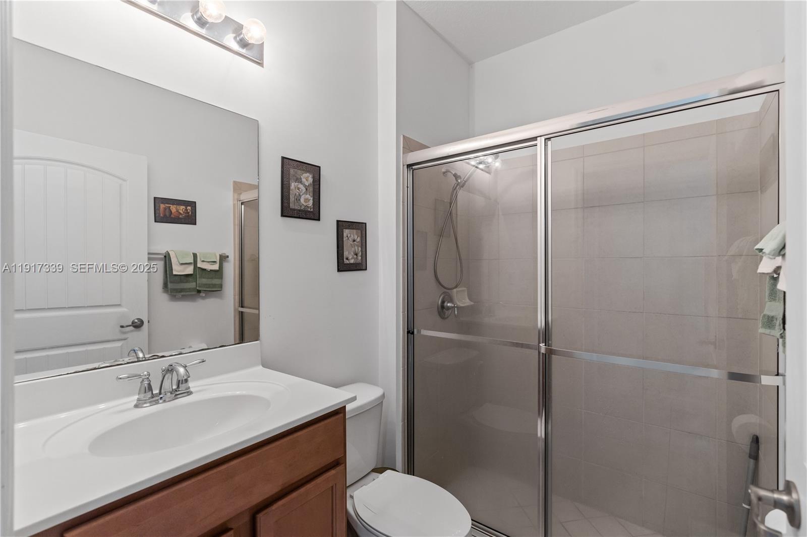 11121 Southwest 225th Terrace Miami, FL 33170 - Photo 12 of 41 a bathroom with a sink toilet and shower