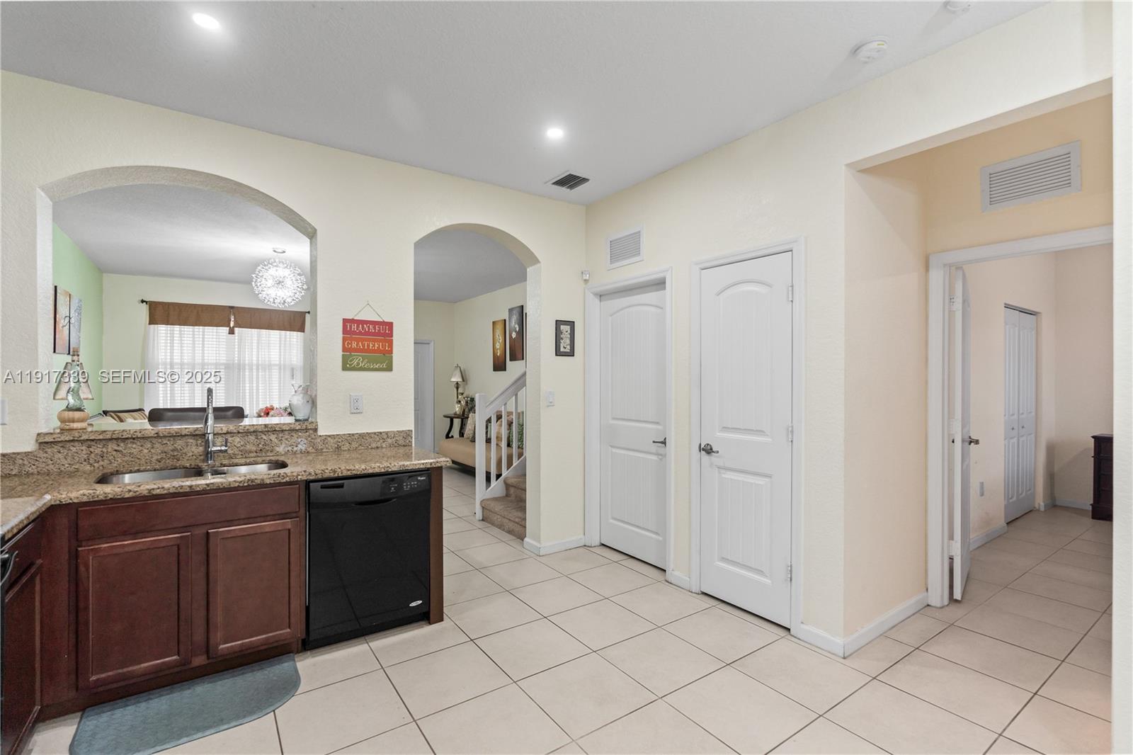 11121 Southwest 225th Terrace Miami, FL 33170 - Photo 16 of 41 a spacious bathroom with a granite countertop sink two mirror and a