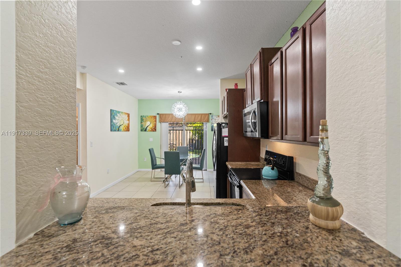 11121 Southwest 225th Terrace Miami, FL 33170 - Photo 23 of 41 a view of a hallway with fountain