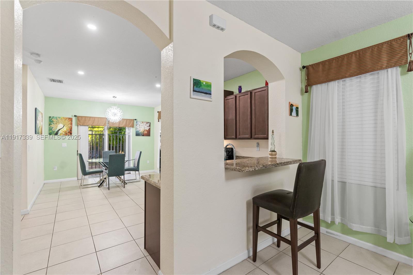 11121 Southwest 225th Terrace Miami, FL 33170 - Photo 24 of 41 a view of a hallway with seating area and furniture