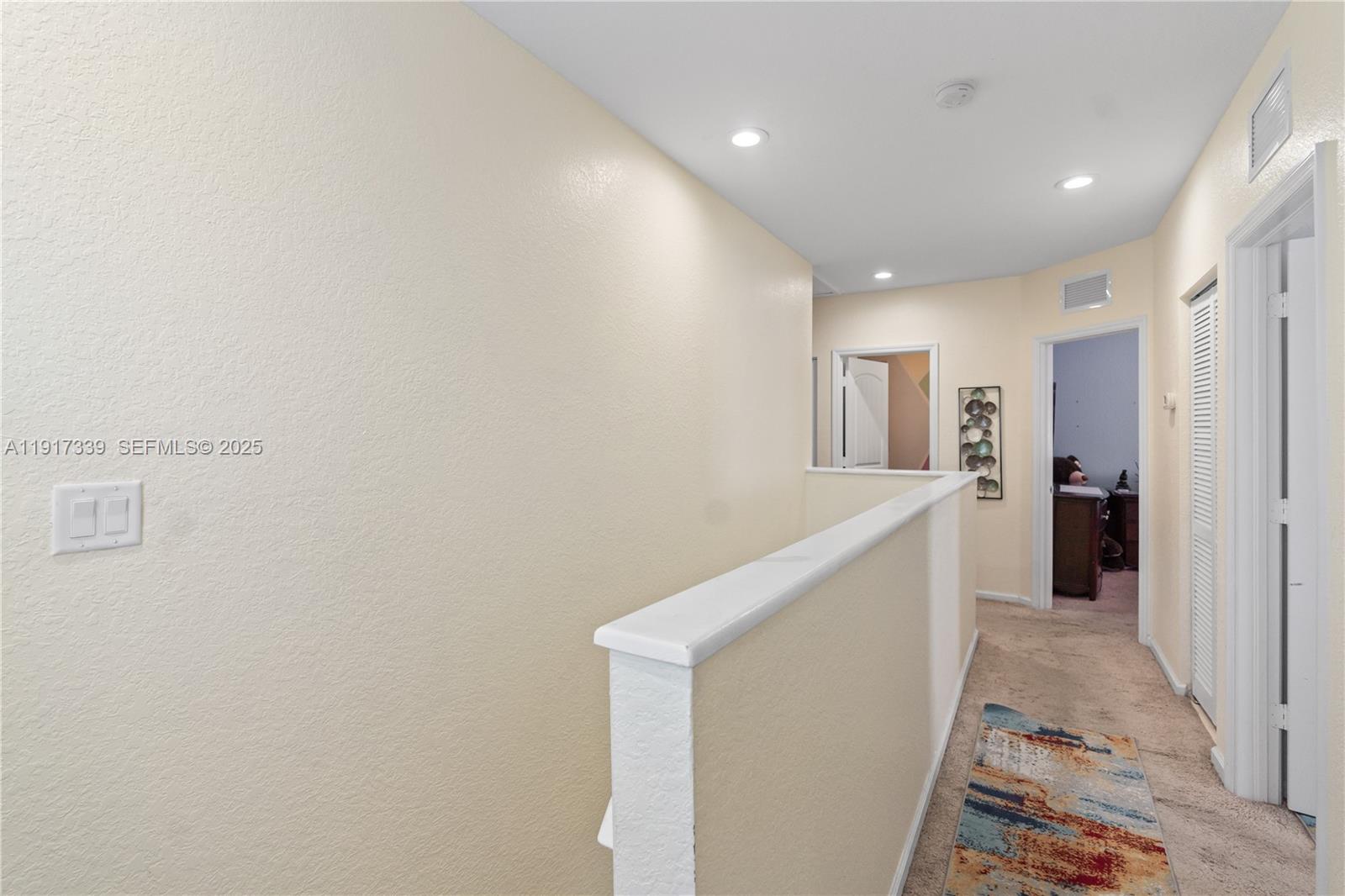 11121 Southwest 225th Terrace Miami, FL 33170 - Photo 29 of 41 a view of hallway with stairs and wooden floor