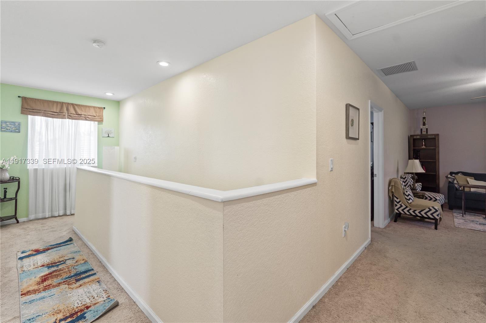 11121 Southwest 225th Terrace Miami, FL 33170 - Photo 30 of 41 a view of a hallway with furniture and windows