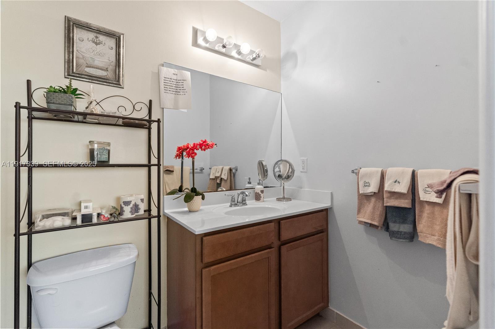11121 Southwest 225th Terrace Miami, FL 33170 - Photo 41 of 41 a bathroom with a sink vanity and mirror