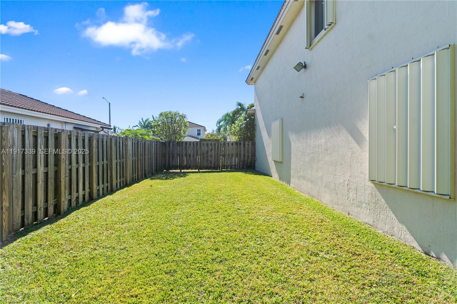 11121 Southwest 225th Terrace Miami, FL 33170 - Photo 9 of 41 a view of a backyard