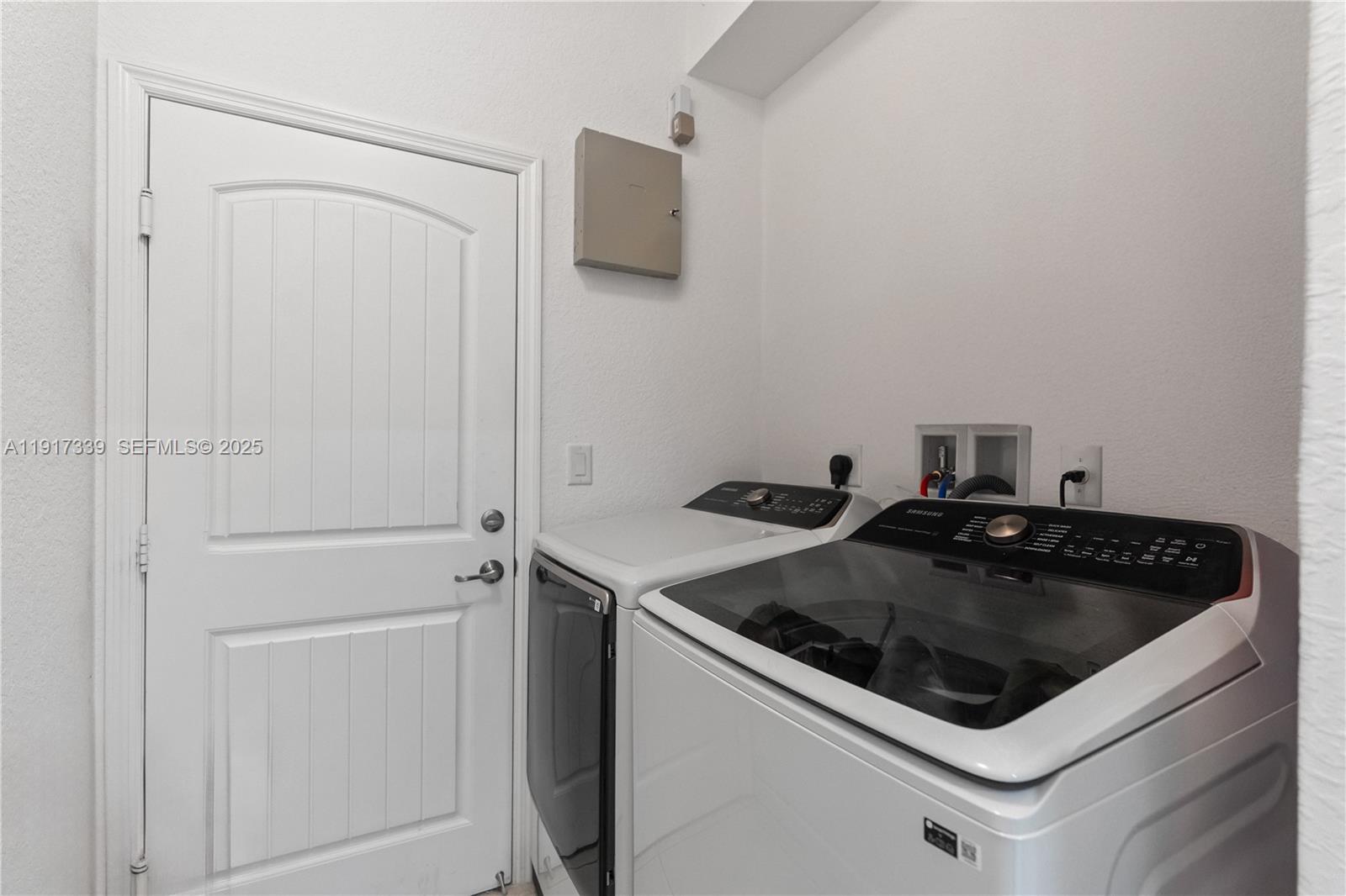 11121 Southwest 225th Terrace Miami, FL 33170 - Photo 10 of 41 a white stove top oven sitting inside of a kitchen