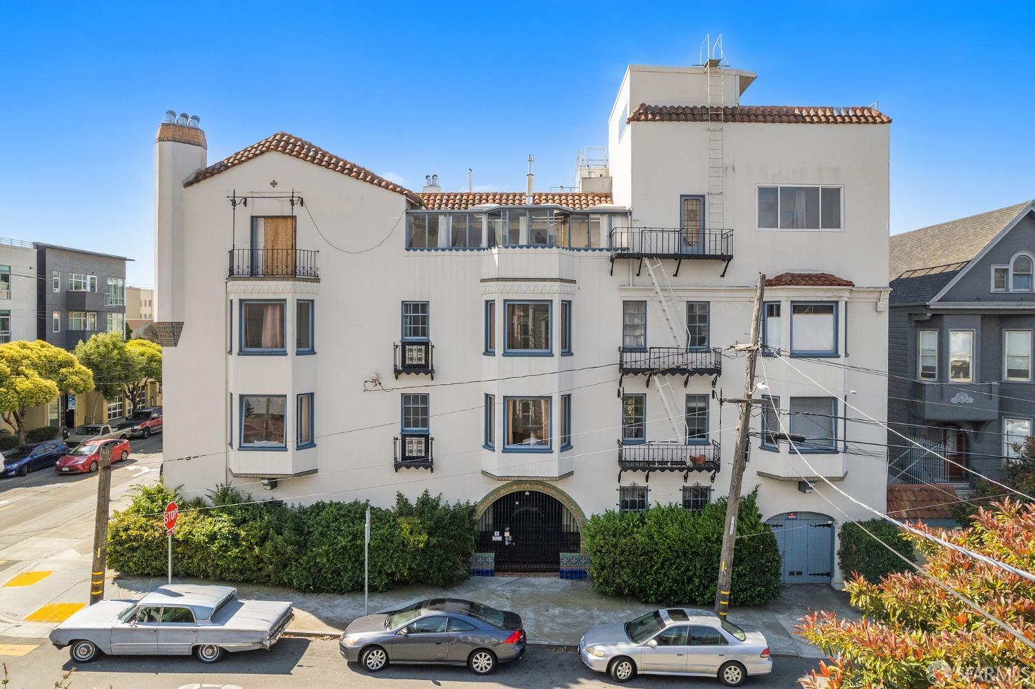 201 Waller Street San Francisco, CA 94102 - Photo 1 of 17 a front view of a residential apartment building with a yard