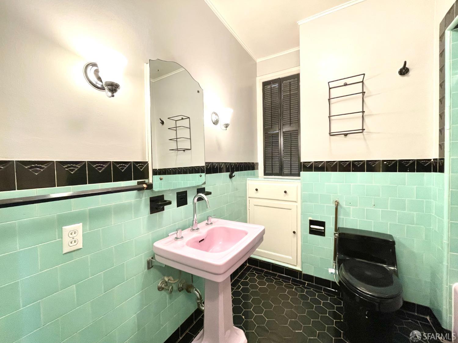 201 Waller Street San Francisco, CA 94102 - Photo 9 of 17 a bathroom with a sink and a mirror