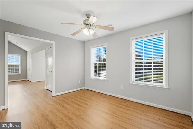 a view of a pool with a table and chairs