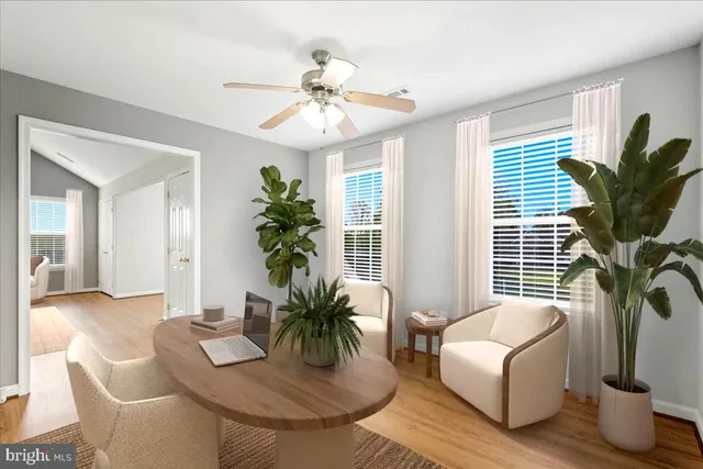 a view of swimming pool with seating area