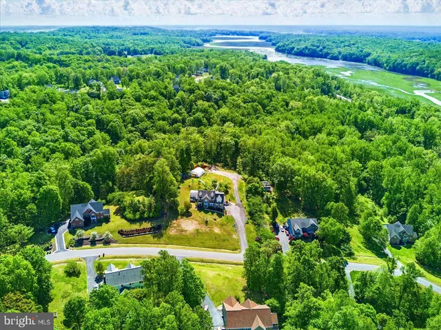 an aerial view of house with yard