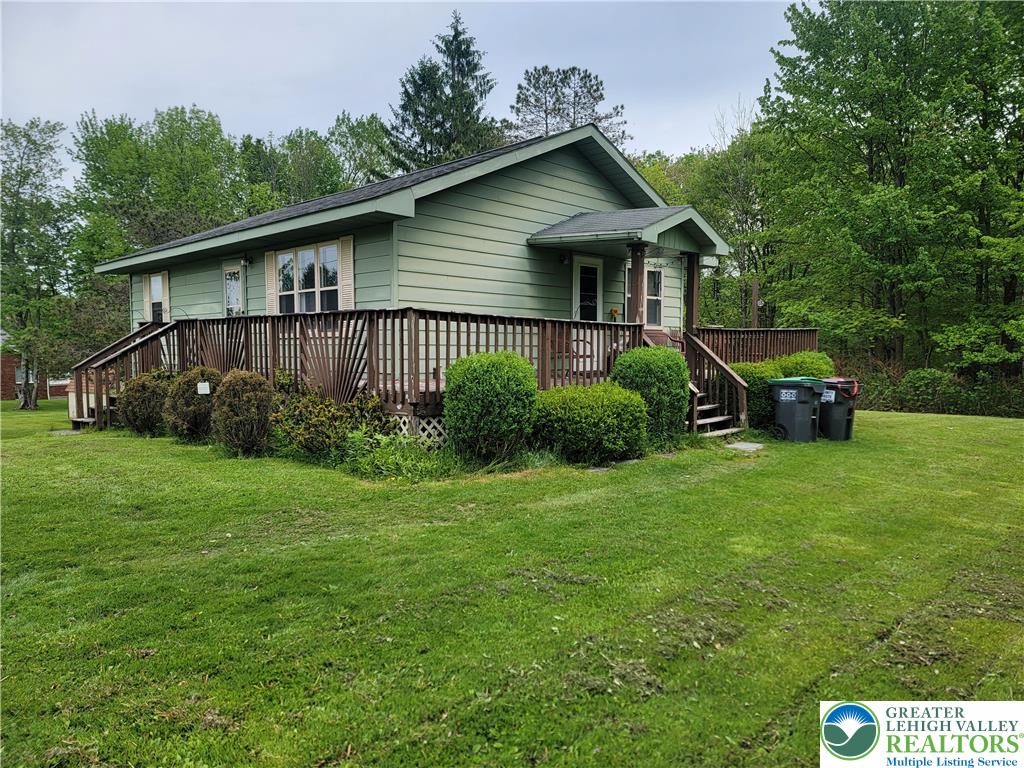 320 Hillside Street Forest City, PA 18421 - Photo 2 of 24 a front view of a house with garden