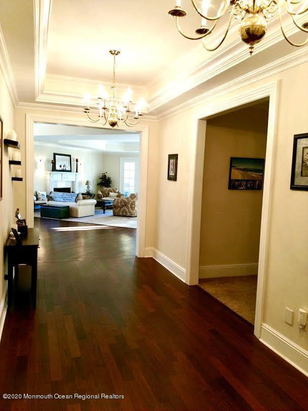 321 Oval Road Manasquan, NJ 08736 - Photo 16 of 23 a view of kitchen and dining room with wooden floor