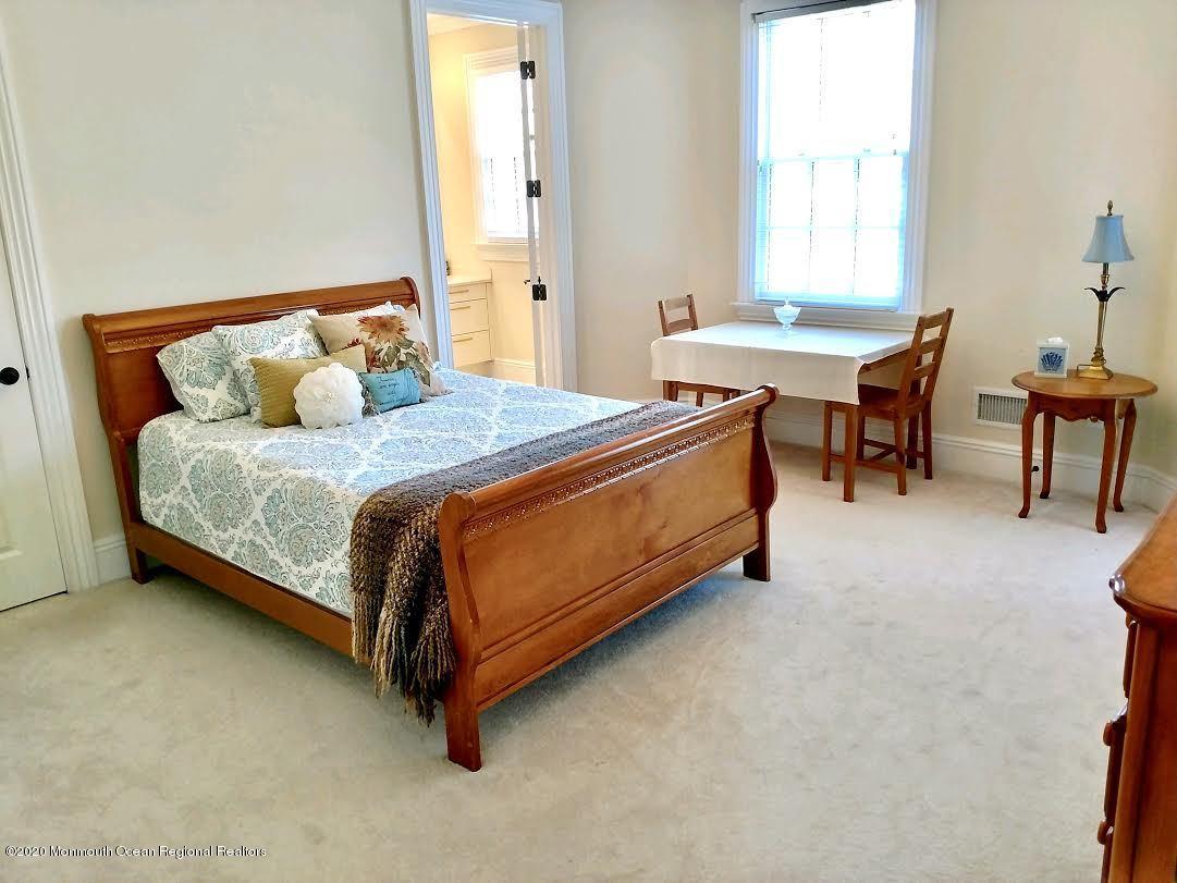 321 Oval Road Manasquan, NJ 08736 - Photo 17 of 23 a bedroom with a bed chair and a window