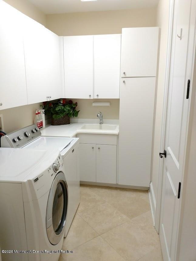 321 Oval Road Manasquan, NJ 08736 - Photo 20 of 23 a utility room with dryer and washer