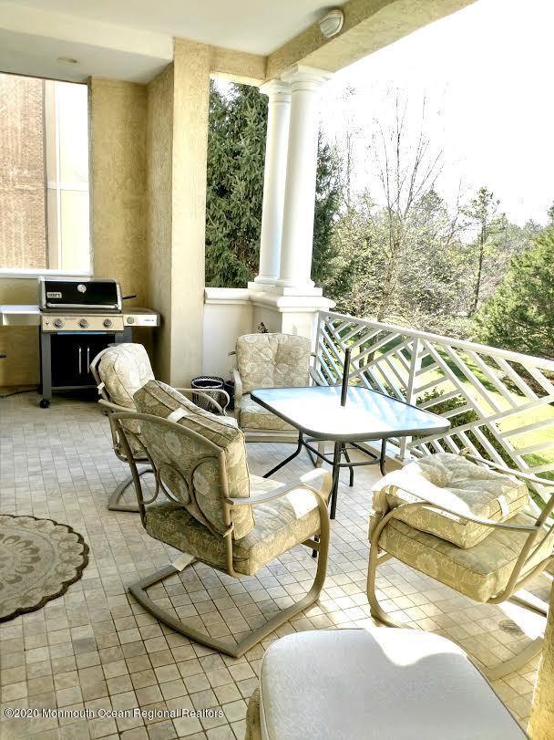 321 Oval Road Manasquan, NJ 08736 - Photo 22 of 23 a living room with furniture and a window