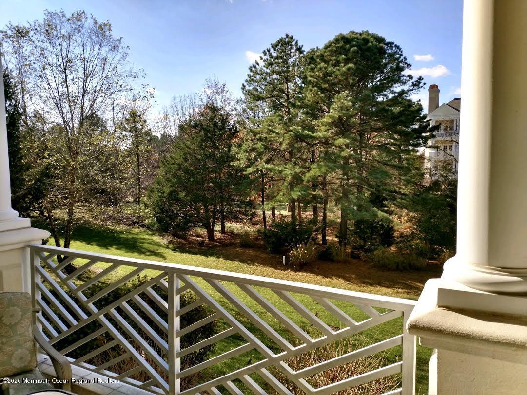 321 Oval Road Manasquan, NJ 08736 - Photo 23 of 23 a view of a yard with plants and trees
