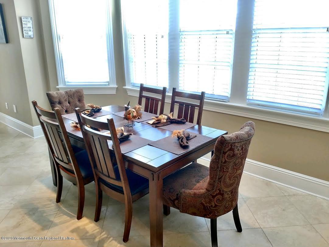 321 Oval Road Manasquan, NJ 08736 - Photo 10 of 23 a view of a dining room with furniture and window