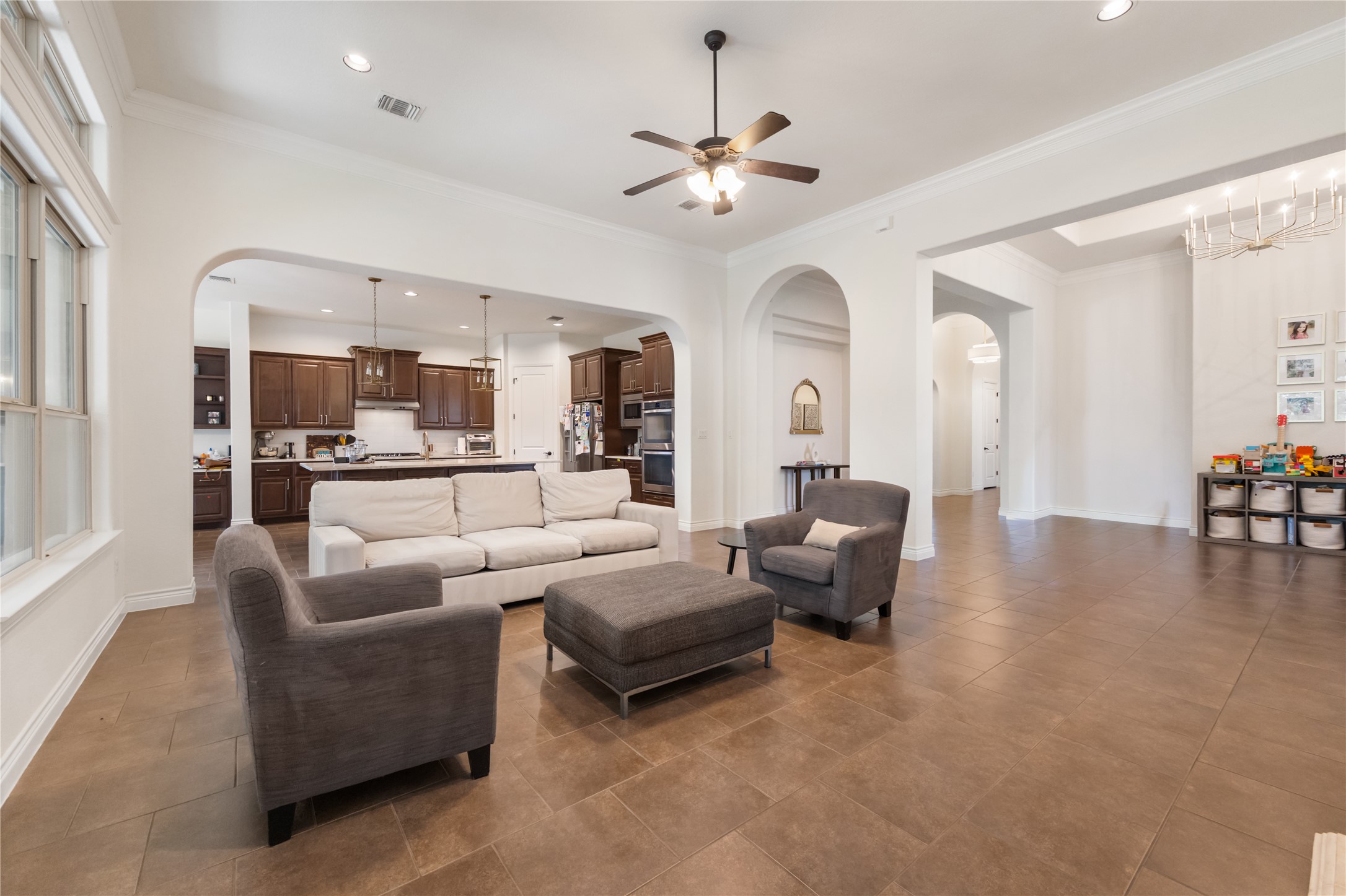 415 Bitterroot Lane Austin, TX 78737 - Photo 6 of 25 An inviting open-concept layout unites the living area and kitchen, perfect for seamless entertaining.