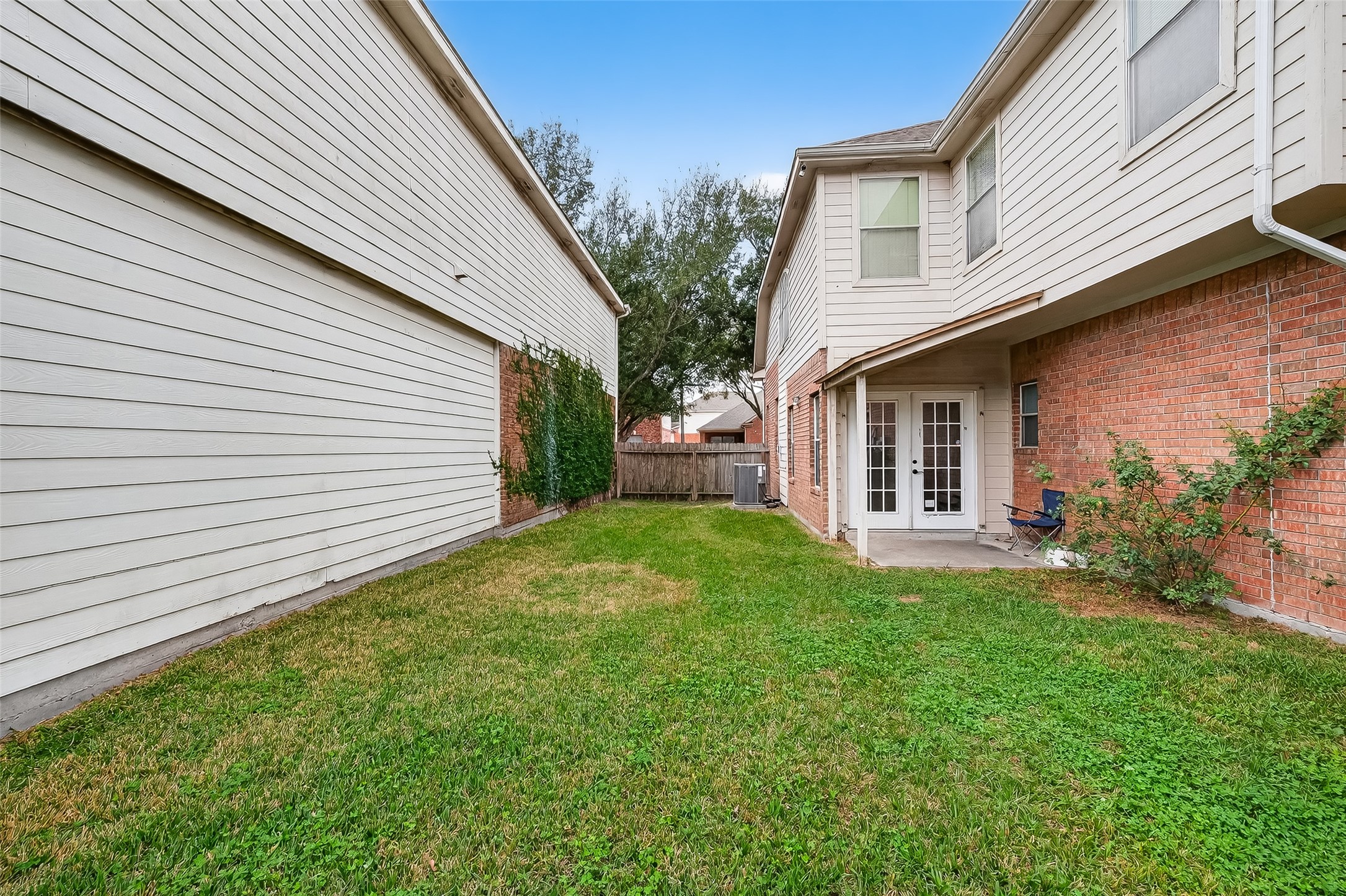 15903 Timber Chase Drive Houston, TX 77082 - Photo 12 of 20 a view of backyard of house with green space