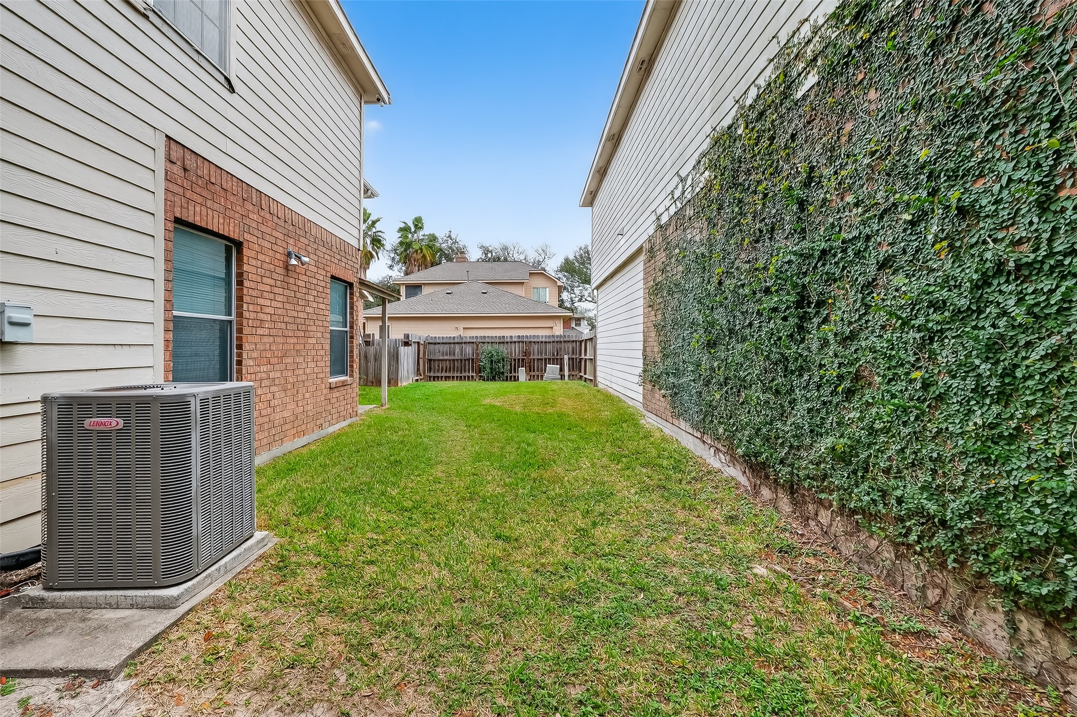 15903 Timber Chase Drive Houston, TX 77082 - Photo 14 of 20 a view of a house with a small yard and wooden fence