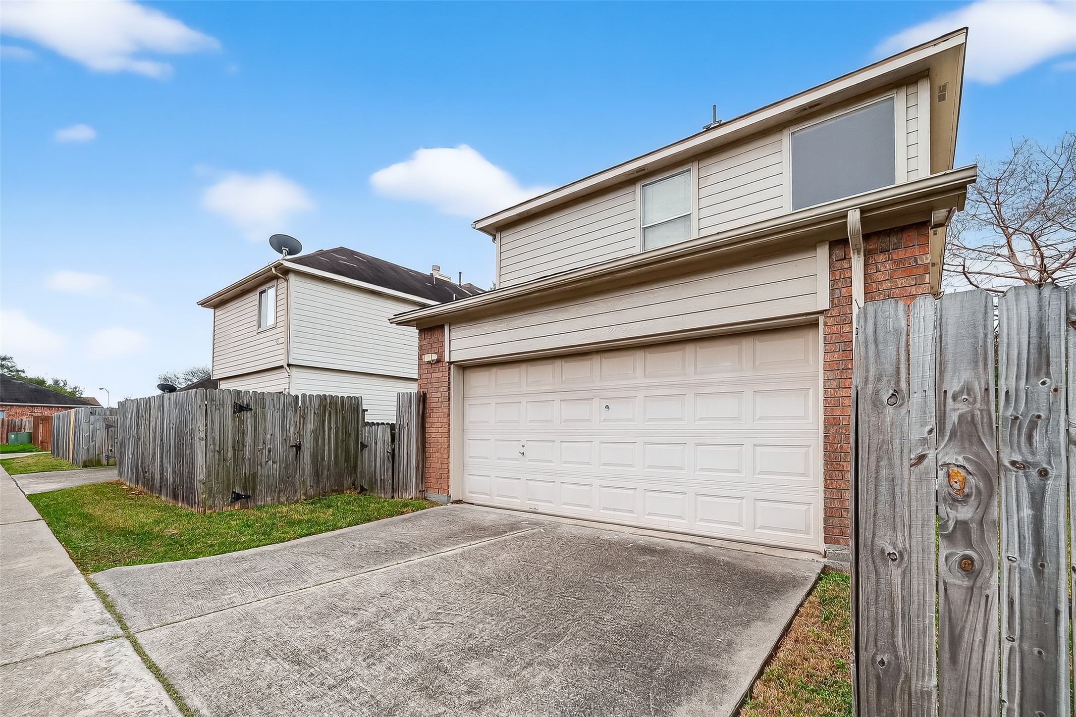 15903 Timber Chase Drive Houston, TX 77082 - Photo 18 of 20 a view of a house with a small yard and wooden fence